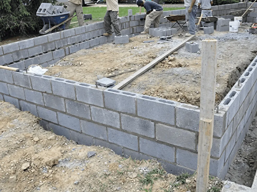 Professionals building a foundation with blocks in Duluth, MN