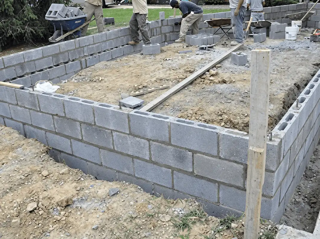 Professionals building a foundation with blocks in Duluth, MN
